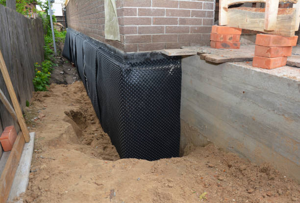 Happy homeowners after waterproofing job in New Riegel